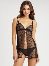 Delicate embroidery and bow accents define this sheer babydoll and thong set.Sheer construction with split frontAdjustable satin strapsSheer thong includedNylon/elastane/polyesterFully linedHand washImported of Italian fabric Delicate embroidery and bow accents define this sheer babydoll and thong set.Sheer construction with split frontAdjustable satin strapsSheer thong includedNylon/elastane/polyesterFully linedHand washImported of Italian fabric