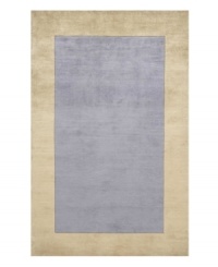 Timeless allure. This attractive area rug illuminates your home with soft, light blue color, offset by a refined beige-toned border. Hand-tufted and hand-carved with plush Chinese wool, the rug offers splendid softness and a deep finish that rivals the finest Tibetan weaves. Timeless allure. This attractive area rug illuminates your home with soft, light blue color, offset by a refined beige-toned border. Hand-tufted and hand-carved with plush Chinese wool, the rug offers splendid softness and a deep finish that rivals the finest Tibetan weaves.