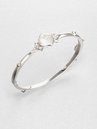 From the Superstud Collection. A graceful bangle of bright sterling silver is dotted with pointy studs and highlighted by a faceted cushion of mother-of-pearl layered with clear quartz for a luminous effect.Mother-of-pearl and clear quartzRhodium-plated sterling silverDiameter, about 2.25Box-and-tongue claspImported