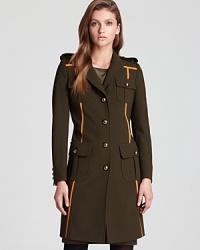 Punchy neon trims update this modern military-style Moschino Cheap and Chic coat, complete with gold buttons and a back drawstring waist. Punchy neon trims update this modern military-style Moschino Cheap and Chic coat, complete with gold buttons and a back drawstring waist.