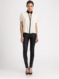 Delicate woven silk outlined with rich leather trim in a sexy menswear-inspired look.Button-front point collarDropped shouldersShort sleevesCutout v-neckAbout 22 from shoulder to hemBody: 92% silk/8% LycraTrim: leatherDry cleanMade in USA of imported fabricModel shown is 5'11 (180cm) wearing US size 4. Delicate woven silk outlined with rich leather trim in a sexy menswear-inspired look.Button-front point collarDropped shouldersShort sleevesCutout v-neckAbout 22 from shoulder to hemBody: 92% silk/8% LycraTrim: leatherDry cleanMade in USA of imported fabricModel shown is 5'11 (180cm) wearing US size 4.