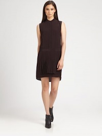 Modern take on the classic shirtdress, this sleeveless go-to is styled with a mandarin collar, drop waist and pleated front overlay. Buttoned mandarin collar with back cutoutSleevelessHidden button frontDrop waistPleated front overlayCropped front hemAbout 18 from natural waist65% acetate/35% silkDry cleanImported of Italian fabricModel shown is 5'10 (177cm) wearing US size 2. Modern take on the classic shirtdress, this sleeveless go-to is styled with a mandarin collar, drop waist and pleated front overlay. Buttoned mandarin collar with back cutoutSleevelessHidden button frontDrop waistPleated front overlayCropped front hemAbout 18 from natural waist65% acetate/35% silkDry cleanImported of Italian fabricModel shown is 5'10 (177cm) wearing US size 2.