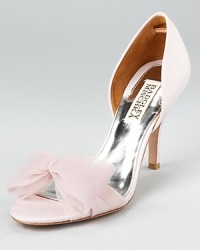 A glamourous and feminine d'Orsay silhouette shines on these Badgley Mischka sandals, adorned with an organza bow at the toe. A glamourous and feminine d'Orsay silhouette shines on these Badgley Mischka sandals, adorned with an organza bow at the toe.