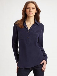 Classic henley style reimagined in fine silk with an easy, oversized shape and convertible sleeves.Point collar Partial front snap placket Long sleeves with snap cuffs convert to ¾ sleeves with button tabs Front patch pockets Shirttail hem Center back box pleat Back seaming with cutout detail About 27 from shoulder to hem Silk; dry clean Imported Classic henley style reimagined in fine silk with an easy, oversized shape and convertible sleeves.Point collar Partial front snap placket Long sleeves with snap cuffs convert to ¾ sleeves with button tabs Front patch pockets Shirttail hem Center back box pleat Back seaming with cutout detail About 27 from shoulder to hem Silk; dry clean Imported