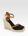 Rich canvas with smooth leather trim forms this classic silhouette, resting on a textured espadrille wedge. Covered wedge, 4 (100mm)Covered platform, ½ (15mm)Compares to a 3½ heel (90mm)Canvas upper with leather trimAdjustable ankle strapCanvas liningRubber solePadded insoleImported