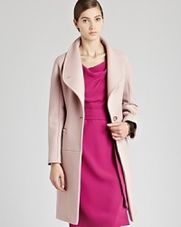 With a REISS coat, you won't have to sacrifice style when inclement weather arrives. Slip on the Myla with a modern funnel neck, and its warm wool blend and three-quarter length will keep you cozy throughout the season. With a REISS coat, you won't have to sacrifice style when inclement weather arrives. Slip on the Myla with a modern funnel neck, and its warm wool blend and three-quarter length will keep you cozy throughout the season.