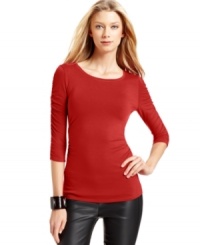 The fitted silhouette of Vince Camuto's scoopneck top is highlighted by ruched details down the sleeves and at the sides. The fitted silhouette of Vince Camuto's scoopneck top is highlighted by ruched details down the sleeves and at the sides.