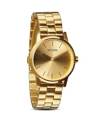 Wearing a simple and sleek gold plated Nixon bracelet watch is a decidedly stylish way to adopt a less-is-more aesthetic, which hints at a well-edited approach to the details. Wearing a simple and sleek gold plated Nixon bracelet watch is a decidedly stylish way to adopt a less-is-more aesthetic, which hints at a well-edited approach to the details.