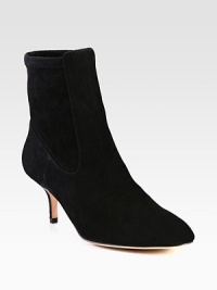 This on-trend suede ankle boot has a back stretch panel for superior comfort. Self-covered heel, 2¾ (70mm)Suede upper and stretch suede back panelPull-on styleLeather lining and solePadded insoleImportedOUR FIT MODEL RECOMMENDS ordering one half size down as this style runs large. This on-trend suede ankle boot has a back stretch panel for superior comfort. Self-covered heel, 2¾ (70mm)Suede upper and stretch suede back panelPull-on styleLeather lining and solePadded insoleImportedOUR FIT MODEL RECOMMENDS ordering one half size down as this style runs large.