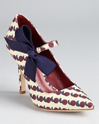 A sweet ribbon details these Tory Burch pumps, boasting a pointed toe and a pretty print. A sweet ribbon details these Tory Burch pumps, boasting a pointed toe and a pretty print.