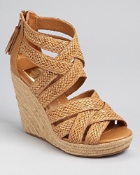 Braided and bound, these summer-loving wedges from DV Dolce Vita are finished with a chic leather tassel at the back. A raffia sole adds warm-weather wonder. Braided and bound, these summer-loving wedges from DV Dolce Vita are finished with a chic leather tassel at the back. A raffia sole adds warm-weather wonder.