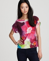 Alice + Olivia demonstrate flower power in a stretch silk top that blooms all season long. Alice + Olivia demonstrate flower power in a stretch silk top that blooms all season long.