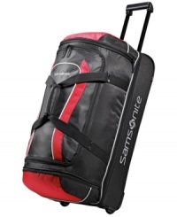Stay on the move. This rolling duffel is crafted from a highly durable polyester and protected by end bumpers and bottom runners for a long-lasting presence that maneuvers trip after trip with incredible ease. The perfect size for last-minute getaways, this drop-bottom duffel features an easy-access exterior zip pocket and a spacious ready-to-pack interior. Stay on the move. This rolling duffel is crafted from a highly durable polyester and protected by end bumpers and bottom runners for a long-lasting presence that maneuvers trip after trip with incredible ease. The perfect size for last-minute getaways, this drop-bottom duffel features an easy-access exterior zip pocket and a spacious ready-to-pack interior.