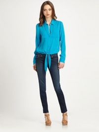 Shimmering silk button-down shirt has a point collar, front self ties and an elasticized back hem. Point collarButton frontFront patch pocketsBack patch pocketsLong sleeves with buttoned cuffsSelf ties at hemElasticized back hemSilkDry cleanImported of Italian fabricModel shown is 5'10 (177cm) wearing US size Small. Shimmering silk button-down shirt has a point collar, front self ties and an elasticized back hem. Point collarButton frontFront patch pocketsBack patch pocketsLong sleeves with buttoned cuffsSelf ties at hemElasticized back hemSilkDry cleanImported of Italian fabricModel shown is 5'10 (177cm) wearing US size Small.