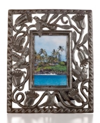 Preserve a beautiful landscape. The Flower Bud picture frame features recycled steel hand-cut with birds and blooms and hammered with a delicate wave motif inspired by Haiti's lively coast. Preserve a beautiful landscape. The Flower Bud picture frame features recycled steel hand-cut with birds and blooms and hammered with a delicate wave motif inspired by Haiti's lively coast.