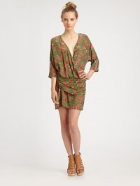 Silk crossover v-neck in a camo-inspired floral print with three-quarter dolman sleeves and a shirred overlay that rests on the hips. Crossover v-neckThree-quarter dolman sleevesShirred overlay at drop waistAbout 17 from natural waistSilkDry cleanImportedModel shown is 5'9½ (176cm) wearing US size 2. Silk crossover v-neck in a camo-inspired floral print with three-quarter dolman sleeves and a shirred overlay that rests on the hips. Crossover v-neckThree-quarter dolman sleevesShirred overlay at drop waistAbout 17 from natural waistSilkDry cleanImportedModel shown is 5'9½ (176cm) wearing US size 2.
