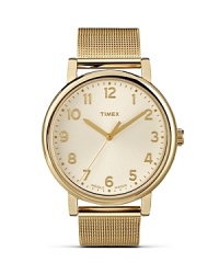 Practical, punctual and pretty. Timex's gleaming gold-plated ticker flaunts a mesh bracelet for feminine flair around the clock. Practical, punctual and pretty. Timex's gleaming gold-plated ticker flaunts a mesh bracelet for feminine flair around the clock.