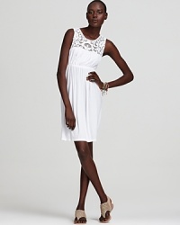 Nola Z's trend-right white dress softens summer style with luxe lace and an easy silhouette.