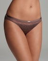 Calvin Klein Underwear's basic bikini is cut in a flattering silhouette with all-over dots and lace trim at the waist. Style #F3308.