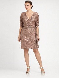 A timeless look enhanced by spectacular sequins and self-tie belt to define your waist and create a perfect hourglass silhouette. V-necklineElbow-length sleevesSelf-tie beltConcealed back zipperAbout 20 from natural waistSilkSpot cleanImported A timeless look enhanced by spectacular sequins and self-tie belt to define your waist and create a perfect hourglass silhouette. V-necklineElbow-length sleevesSelf-tie beltConcealed back zipperAbout 20 from natural waistSilkSpot cleanImported