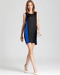 A BCBGMAXAZRIA color block shift dress takes summer's chicest trend and adds a playful element with a back cutout and drape, showing off your flirty side. A BCBGMAXAZRIA color block shift dress takes summer's chicest trend and adds a playful element with a back cutout and drape, showing off your flirty side.