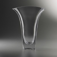 Bring sophistication and elegance to your foyer or dinner table with Karim Rashid's Planar Vase. Reminiscent of his ever popular Planar Bowl, this full-lead crystal vase has a beautifully wide opening to allow your flowers to fall softly against the edges. Bring sophistication and elegance to your foyer or dinner table with Karim Rashid's Planar Vase. Reminiscent of his ever popular Planar Bowl, this full-lead crystal vase has a beautifully wide opening to allow your flowers to fall softly against the edges.
