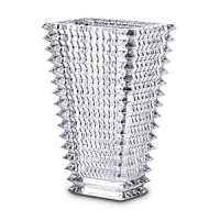 Designed by Nicolas Triboulot for Baccarat, this sparkling crystal vase features extraordinary craftsmanship-horizontal bevel cuts on the outside and vertical bevel cuts on the inside-for a dazzling refractive effect. Designed by Nicolas Triboulot for Baccarat, this sparkling crystal vase features extraordinary craftsmanship-horizontal bevel cuts on the outside and vertical bevel cuts on the inside-for a dazzling refractive effect.