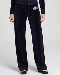 Glam up your weekend wardrobe with these Juicy Couture pants, finished with a rhinestone-encrusted logo for shameless diva appeal. Glam up your weekend wardrobe with these Juicy Couture pants, finished with a rhinestone-encrusted logo for shameless diva appeal.