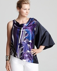 Bursting with vibrant blossoms, this Tahari Woman Plus top makes a modern feminine statement. Team with white denim and spark some serious fashion envy. Bursting with vibrant blossoms, this Tahari Woman Plus top makes a modern feminine statement. Team with white denim and spark some serious fashion envy.