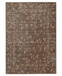 A beautiful lattice of delicate vines and blooming flowers gives this rug its magnetic charm. On a dark khaki ground with soft ivory accents, this densely woven piece invites you into wonderful interior decor. A beautiful lattice of delicate vines and blooming flowers gives this rug its magnetic charm. On a dark khaki ground with soft ivory accents, this densely woven piece invites you into wonderful interior decor.
