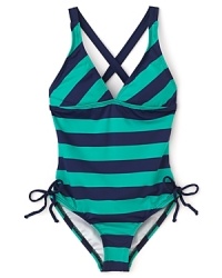 French Riviera-inspired stripes make a bold statement in Juicy Couture's V neck swimsuit. French Riviera-inspired stripes make a bold statement in Juicy Couture's V neck swimsuit.