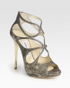 Strappy platform silhouette of lizard-embossed leather with a sleek goldtone heel. Metal heel, 4¾ (120mm)Covered platform, ½ (15mm)Compares to a 4¼ heel, (110mm)Lizard-embossed leather upperBack zipLeather lining and solePadded insoleMade in ItalyOUR FIT MODEL RECOMMENDS ordering one half size up as this style runs small. 