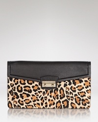 The effortless style of this Cole Haan clutch is ready for night, crafted of leather and designed with pockets to hold all of the desk-to-dinner essentials. The effortless style of this Cole Haan clutch is ready for night, crafted of leather and designed with pockets to hold all of the desk-to-dinner essentials.