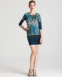 Ali Ro's swirl printed sheath dress lends a timeless look in a cool-hued color palette. Ali Ro's swirl printed sheath dress lends a timeless look in a cool-hued color palette.