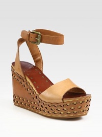 '70s-inspired classic with an adjustable ankle strap and modern laser-cut wedge. Laser-cut leather wedge, 4 (100mm)Laser-cut leather platform, 1½ (40mm)Compares to a 2½ heel (65mm)Leather upperLeather liningRubber solePadded insoleImported