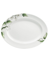 Vera Wang's Floral Leaf watercolor adds fresh artistry to this chic bone china oval platter from her collection of Wedgwood dinnerware. The dishes have a minimalist shape in clean white which blooms with crisp greens for a modern look and feel that's ideal for every day. Vera Wang's Floral Leaf watercolor adds fresh artistry to this chic bone china oval platter from her collection of Wedgwood dinnerware. The dishes have a minimalist shape in clean white which blooms with crisp greens for a modern look and feel that's ideal for every day.