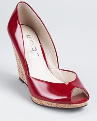 Glossy patent leather and matte natural cork make for a beautiful contrast on these KORS Michael Kors wedges, finished with alluring low cut sides. Glossy patent leather and matte natural cork make for a beautiful contrast on these KORS Michael Kors wedges, finished with alluring low cut sides.