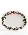 Guests will appreciate the festive look of your holiday table, compliments of Martha Stewart Collection. Graceful boughs of holly and vibrant red ribbons decorate this porcelain oval platter for a joyful look.