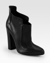 A rounded heel heightens this must-have leather ankle boot with detailed seaming and a classic point toe. Self-covered heel, 5 (125mm)Leather upperPoint toePull-on styleLeather lining and solePadded insoleImported