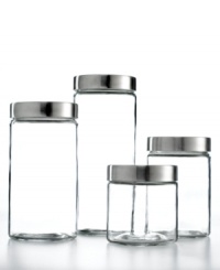 Simple glass canisters with silvertone metal lids offer extensive storage for rice, cereal, pasta and any number of boxed pantry items to preserve freshness and minimize clutter. Simple glass canisters with silvertone metal lids offer extensive storage for rice, cereal, pasta and any number of boxed pantry items to preserve freshness and minimize clutter.