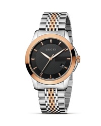 A stainless steel and 18K pink gold watch from the Gucci G-Timeless collection. A stainless steel and 18K pink gold watch from the Gucci G-Timeless collection.