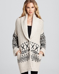 Classic and cozy with a chic shawl collar, this Sonia Rykiel sweater is sure to be your winter weekend go-to. Don't miss the unique woven text treatment, which reads Beauty Amour across the silhouette. Classic and cozy with a chic shawl collar, this Sonia Rykiel sweater is sure to be your winter weekend go-to. Don't miss the unique woven text treatment, which reads Beauty Amour across the silhouette.