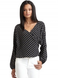 THE LOOKAllover contrasting polka dot printAsymmetric surplice V-neckLong sleeves with elastic cuffsTHE FITAbout 22 from shoulder to hemTHE MATERIALSilkCARE & ORIGINDry cleanImportedModel shown is 5'10 (177cm) wearing US size Small. THE LOOKAllover contrasting polka dot printAsymmetric surplice V-neckLong sleeves with elastic cuffsTHE FITAbout 22 from shoulder to hemTHE MATERIALSilkCARE & ORIGINDry cleanImportedModel shown is 5'10 (177cm) wearing US size Small.