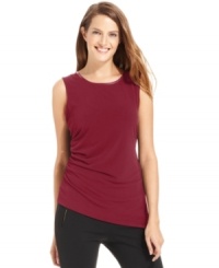Subtle touches make this Calvin Klein top special, like tonal faux leather at the neckline and an aysmmetrical hem. Subtle touches make this Calvin Klein top special, like tonal faux leather at the neckline and an aysmmetrical hem.