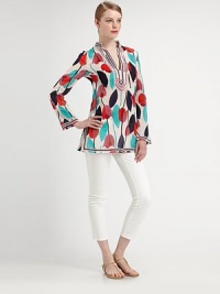 Finely spun cotton meets an irresistible floral-leaf print creating a requisite, signature Tory Burch tunic.Split neckLong sleevesSide slitsAbout 29 from shoulder to hemCottonDry cleanImported Model shown is 5'10 (177cm) wearing US size 4. OUR FIT MODEL RECOMMENDS ordering true size. Finely spun cotton meets an irresistible floral-leaf print creating a requisite, signature Tory Burch tunic.Split neckLong sleevesSide slitsAbout 29 from shoulder to hemCottonDry cleanImported Model shown is 5'10 (177cm) wearing US size 4. OUR FIT MODEL RECOMMENDS ordering true size.