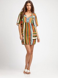 A coverup inspired by the tropics with coconut buttons, natural jute trim and bright colors.Button placketShort sleevesPull-on styleFront pockets74% cotton/26% silkDry cleanMade in USA of imported fabric A coverup inspired by the tropics with coconut buttons, natural jute trim and bright colors.Button placketShort sleevesPull-on styleFront pockets74% cotton/26% silkDry cleanMade in USA of imported fabric