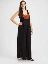 An elongated column of stretch jersey, finished with a chic stone embellishment for an exotic touch.Wide straps Scoopneck Pullover style Rayon Dry clean or hand wash Made in USA An elongated column of stretch jersey, finished with a chic stone embellishment for an exotic touch.Wide straps Scoopneck Pullover style Rayon Dry clean or hand wash Made in USA