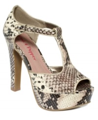 Super chunky platforms get even more of a boost, thanks to a cool snakeskin print. Pink and Pepper's Lunar platform sandals feature a t-strap at the vamp and pretty peep-toe. Super chunky platforms get even more of a boost, thanks to a cool snakeskin print. Pink and Pepper's Lunar platform sandals feature a t-strap at the vamp and pretty peep-toe.