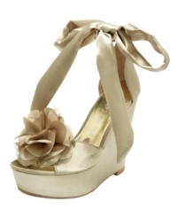Satin ankle ties and fluffy rosette detailing on the Janice wedge sandals by Paris Hilton create a look that's both sweet and sultry. Satin ankle ties and fluffy rosette detailing on the Janice wedge sandals by Paris Hilton create a look that's both sweet and sultry.