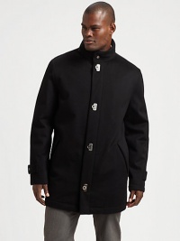 The classic car coat cut from luxurious cashmere and finished with distinctive gancini closures.Stand collarFront gancini closureSlash pocketsAbout 35 from shoulder to hemCashmereDry cleanMade in Italy